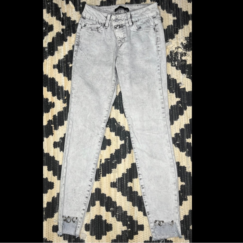 Light acid wash straight leg jeans with studs